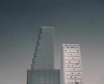 Stepped Towers Three stepped high-rise buildings rise against a muted grey sky.