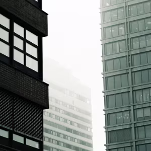 Urban Silence Fine art urban photography featuring foggy architecture, vertical forms and muted cityscapes that emphasize silence,...